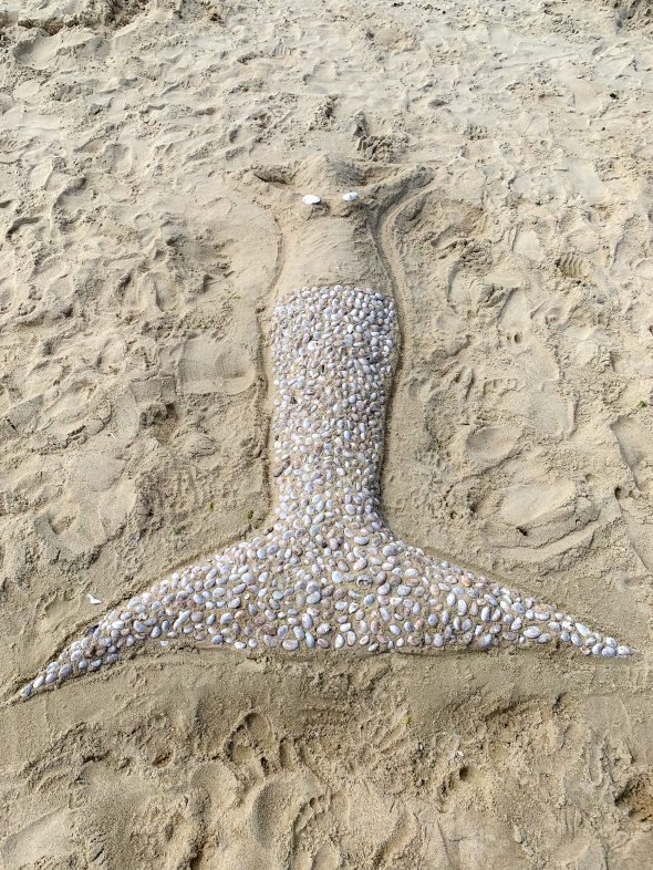 A mermaid crafted out of seashells