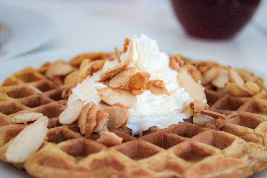 Pumpkin Spice Waffles with Caramelized Almonds and Homemade Whipped Cream