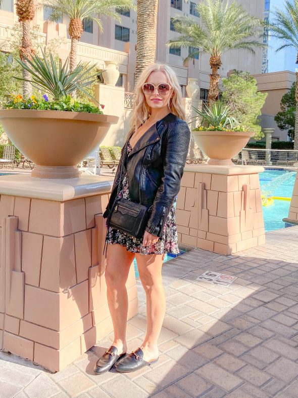 What I wore on the Las Vegas Strip: Superdown floral dress | Topshop vegan leather moto jacket | Rebecca Minkoff crossbody bag | Gucci Princetown mules | Urban Outfitters necklace | Chloe shades