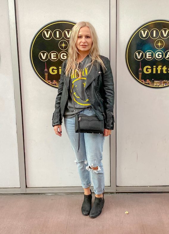 What I wore on the Las Vegas Strip: UO Nirvana "smiley face" tee | Topshop vegan leather moto jacket | Aqua distressed denim jeans | Vince Camuto booties | Rebecca Minkoff crossbody bag | Chloe shades